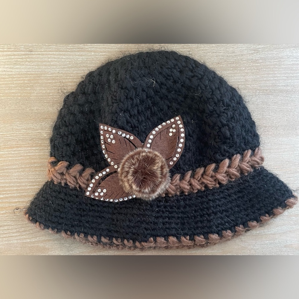 Hand crocheted black brown winter bucket hat floral detail, fleece interior